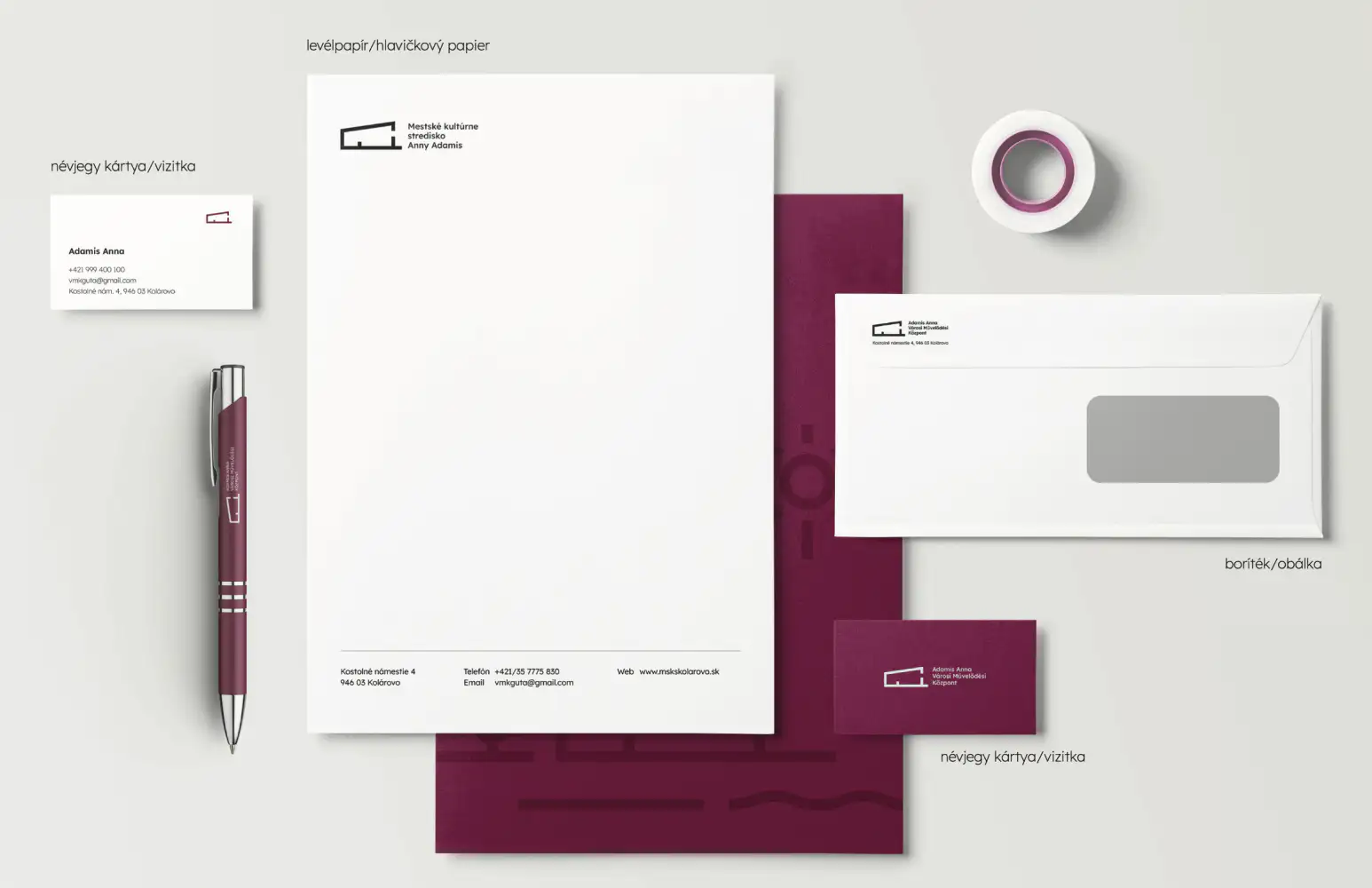 Stationery set in burgundy and white: letterhead, bilingual business cards, envelope, branded pen and tape