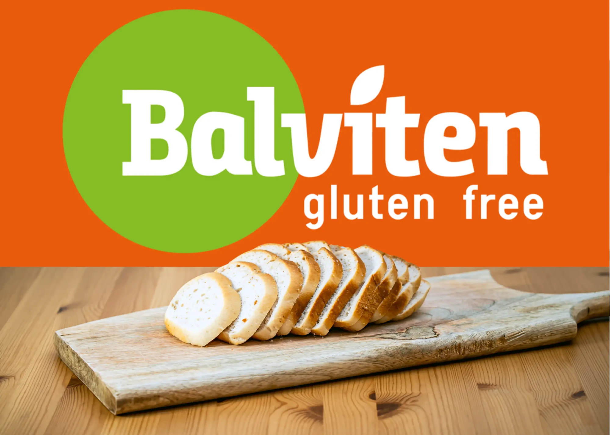 The Balviten gluten free logo above a board of freshly sliced gluten-free bread