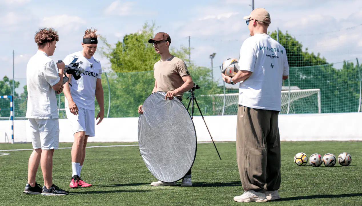 Our crew directing FUTBALIC players between takes on the pitch